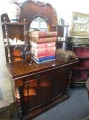 A Victorian mahogany Chiffonier having raised back with oval mirror, 103cms