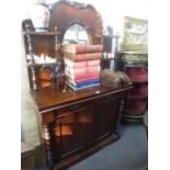 A Victorian mahogany Chiffonier having raised back with oval mirror, 103cms