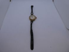 Vintage ladies yellow gold wristwatch with pearlescent dial on black leather strap - cannot open bac