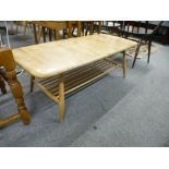 An Ercol light oak oblong coffee table having shelf under 104.5cms