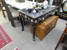 A French style lacquered desk having three drawers on cabriole legs, 126 cms