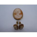 9ct Oval cameo brooch and a pair of 9ct Cameo earrings, marked 9ct