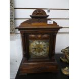 An early 20th century walnut mantel clock, having Art Nouveau styling, height 31cms