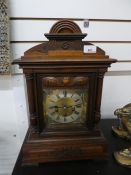 An early 20th century walnut mantel clock, having Art Nouveau styling, height 31cms