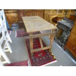 Two similar wooden trestle tables, the underneath stamped G R V I, one dated 1944, length 136cms