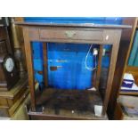 An antique oak side table having one drawer on square tapered legs, 79cm