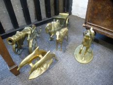 A brass cannon, a brass cart and two horses and two other brass items