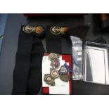 Four old silver badges for football and cricket, two cap badges and sundry