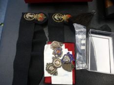 Four old silver badges for football and cricket, two cap badges and sundry