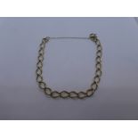 Unmarked yellow metal bracelet, with safety chain, weight approx 9.7g