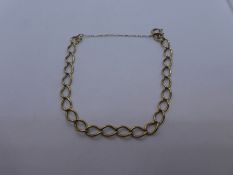 Unmarked yellow metal bracelet, with safety chain, weight approx 9.7g