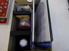 A 2008 Olympic dames silver proof £2 coin, a 2008 Queen Elizabeth I £5 silver proof coin and other c