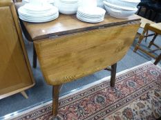 An Ercol two flap kitchen table on square legs and an Ercol oblong coffee table on refectory style b