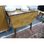 An Ercol two flap kitchen table on square legs and an Ercol oblong coffee table on refectory style b