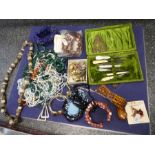 Jewellery box containing hardstone bead necklaces, amber style necklace cased manicure set, etc