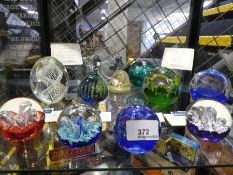 A quantity of Caithness paperweights and others