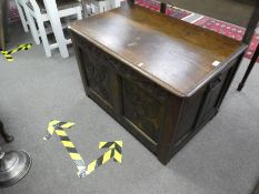 An antique oak coffer having carved front, 92 cms