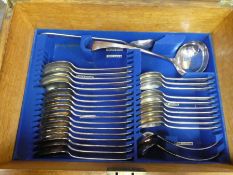 An oak canteen of cutlery having three removeable trays, mainly complete