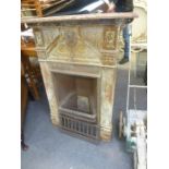 A Victorian cast iron fireplace, with grate