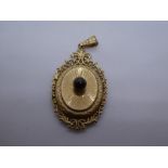 9ct yellow gold oval locket, with central red stone, marked 375, 4cm, weight approx 5.8g