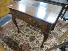 An antique oak side table having one long drawer on cabriole legs, 77 cms