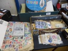 A small carton of used stamps, some in albums and sundry