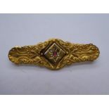 9ct Victorian bar brooch of floral design marked 9ct, approx 4cm, weight approx 2.2g, one small seed