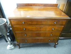 A large 1930s walnut chest having four long graduated drawers on cabriole legs, 98 cms,
