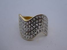 Contemporary unmarked yellow gold wave design dress ring, set with 70 small brilliant cut diamonds,