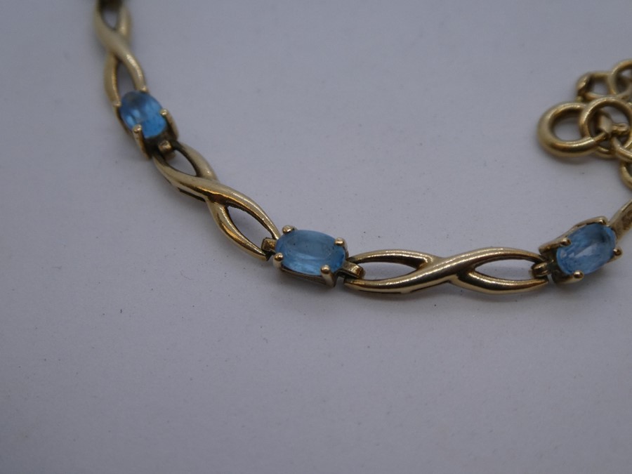 Pretty 9ct yellow gold bracelet set with 9 pale blue stones, marked 375 - Image 4 of 4