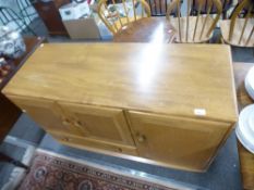 An Ercol Elm sideboard having cupboard and one drawer, 114 cms