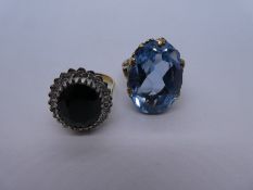 9ct yellow gold dress ring with large central Sapphire surrounded by clear stones, size Q, together