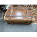 An antique leather travelling case having removeable tray, and side handles, 77cms