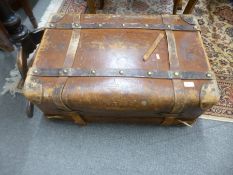 An antique leather travelling case having removeable tray, and side handles, 77cms