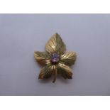 9ct yellow gold brooch in the form of a maple leaf with central circular amethyst, approx 4cm in len