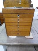 An old mahogany medicine chest having six graduated drawers