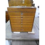 An old mahogany medicine chest having six graduated drawers