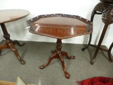 A reproduction tripod table having octagonal top with pierced border, 72 cms