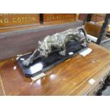 A bronze figure of prowling tiger, unsigned on marble base, 62cms