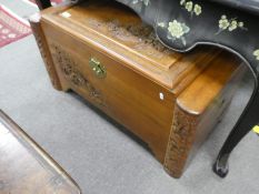 A Chinese carved camphor wood chest, 92 cms