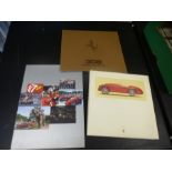 A 19909 hardback book L'idea Ferrari, a 1997 yearbook, and a brochure on the 308 Quattrovalvole