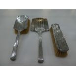 Silver backed three piece dressing table set comprising of two brushes and hand held mirror, Birming
