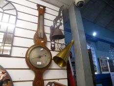 An antique banjo barometer having inlaid decoration