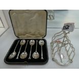 A silver Edwardian toast rack hallmarked London 1905, maker's mark Hukin & Heath, and with a set of