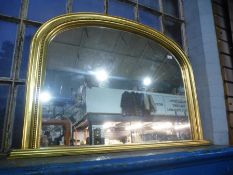 A modern gilt Victorian style overmantel mirror