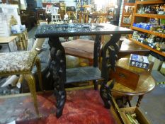 An Eastern carved table and a gilt stool