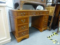 A reproduction pedestal desk