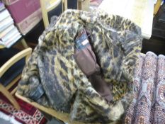 A tray of faux fur coats and similar