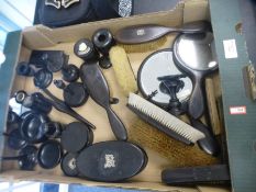 A quantity of ebony dressing table items and similar