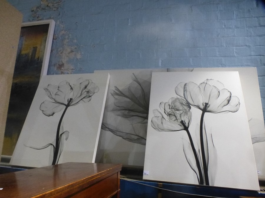 Three modern pictures of flowers and a gilt wall mirror